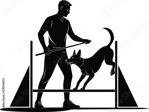 Dog agility training silhouette of a handler guiding a dog over a jump