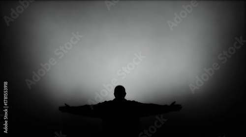 outstretched. A solitary silhouette against a misty backdrop, evoking a sense of quiet contemplation. wellbeing guides, coaching materials, designed for coaching and self-improvement content.