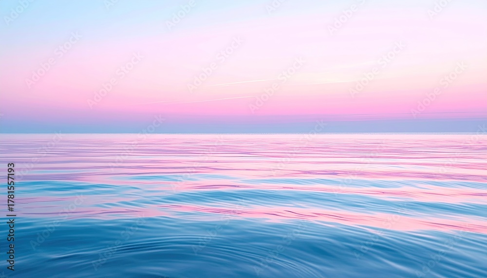 Obraz premium Serene Ocean Sunset Over Calm Water With Pink And Blue Hues Viewed From Tropical Deck