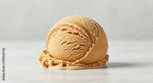 Indulge in creamy, rich caramel ice cream perfection with a sprinkle of sea salt, a decadent treat for any sweet craving.