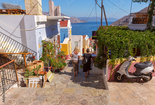 Stone alley with sea view in Symi, Symi, Greece