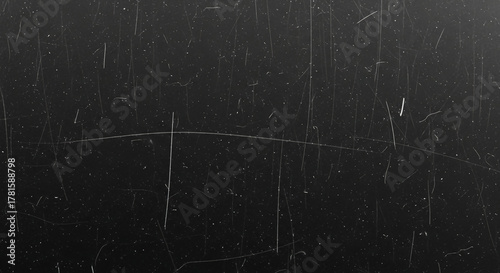 Dark grunge texture with prominent scratches and subtle dust specks, perfect as a versatile digital overlay to add a retro, aged, or distressed feel to your designs