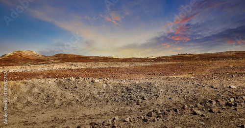 Scenic desert landscape with cloudy sunset sky