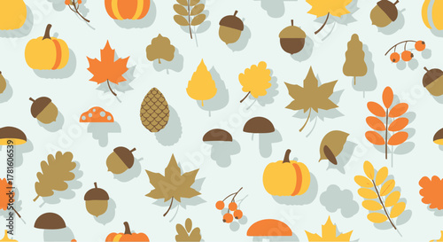 Autumnal arrangement of various leaves pumpkins and acorns creating a fall-themed pattern.