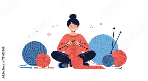 A contented young woman sits cross-legged, engrossed in knitting a long red scarf with needles, surrounded by colorful yarn balls.