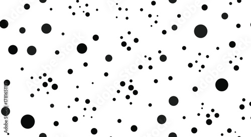 Abstract pattern of scattered black and dark grey dots of varying sizes on a white background, creating a dynamic and textured visual.