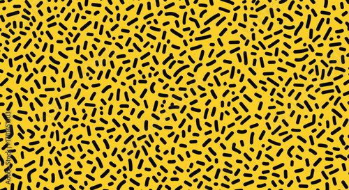 Vibrant yellow background covered in a fun, irregular pattern of hand-drawn black sprinkles and short lines, perfect for a retro theme.