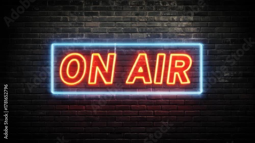 Neon sign glowing on a dark brick wall creating a vibrant atmosphere for live broadcasts and creative events