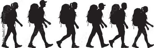 Hiker silhouettes walking with backpacks