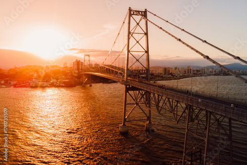 Hercilio luz old bridge with sunset light in Florianopolis city, Brazil. Aerial view