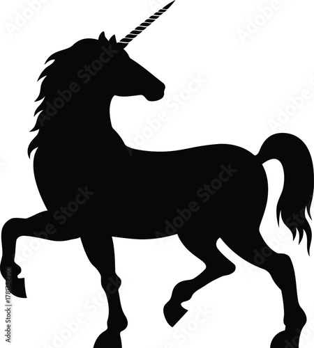 Silhouette of a majestic unicorn standing with one leg raised in a magical fantasy setting