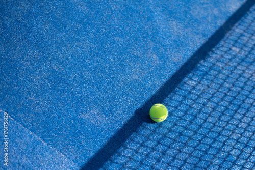 Obraz na płótnie One tennis ball on blue court near net