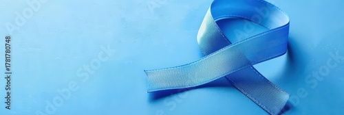 Blue awareness ribbon on light background for world diabetes day observance. Horizontal banner. Copy space. Healthcare and medical concept. Parkinson's disease, Men's health awareness