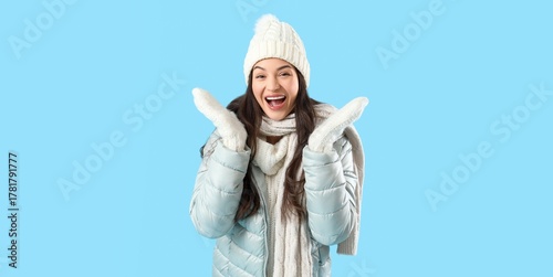 Happy young woman in winter...