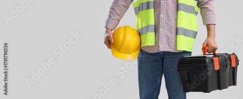 Male worker with hardhat an...
