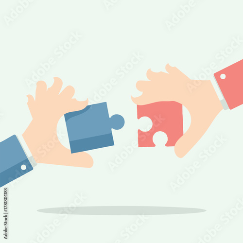 Hands connecting puzzle pieces representing teamwork and collaboration in business.