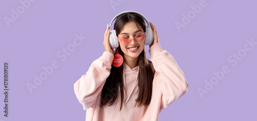 Young woman in headphones o...