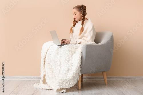 Happy young woman in warm s...