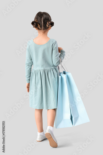 Cute little girl with shopp...