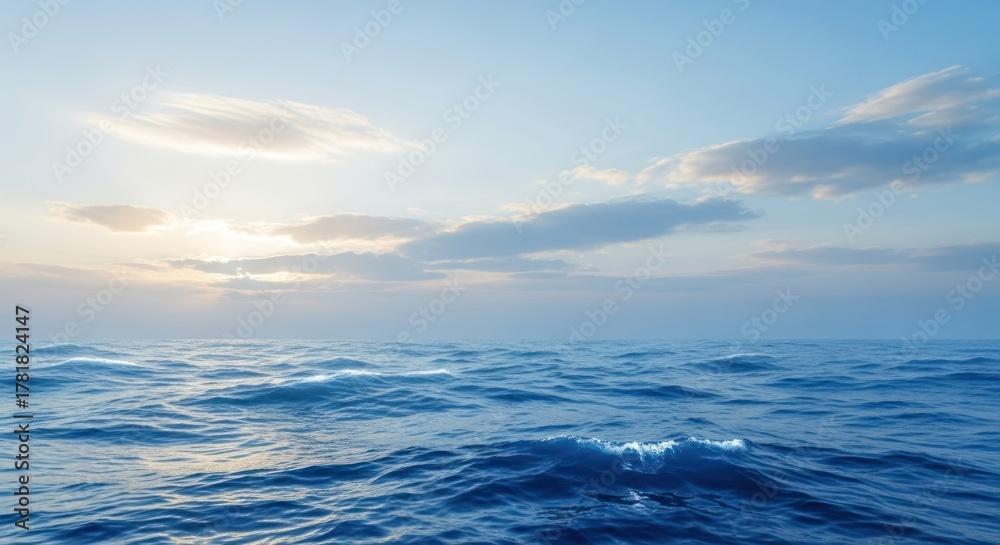 Fototapeta premium A vast expanse of the ocean with waves crashing against the shore.