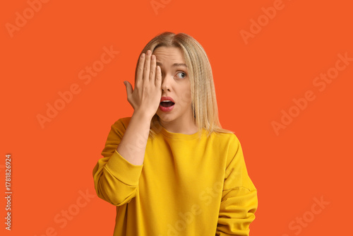 Embarrassed young woman on ...