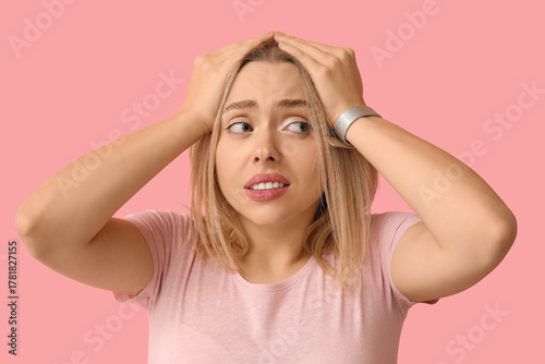 Embarrassed young woman on ...