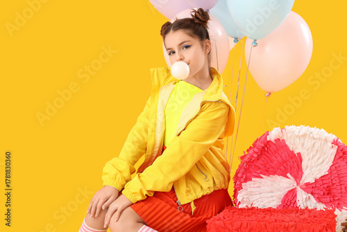 Trendy girl with pinatas an...