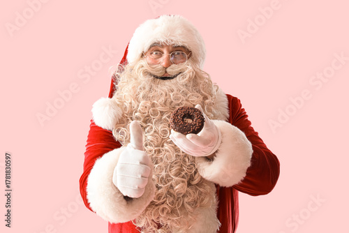 Santa Claus with tasty donu...