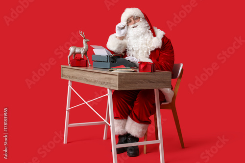 Santa claus working at desk...