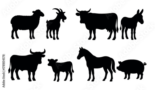 Silhouettes of farm animals against dark background