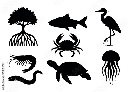 Silhouette of aquatic creatures and mangrove tree against black background