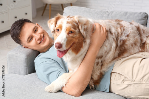 Happy young man with cute A...