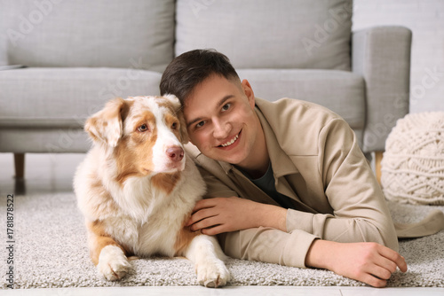Happy young man with cute A...