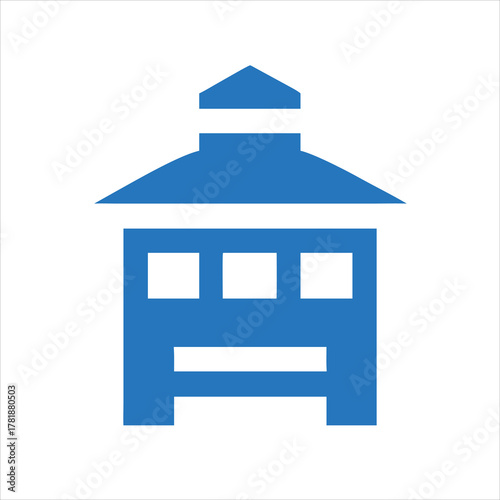 Fire station silhouette with double garage door and tower,