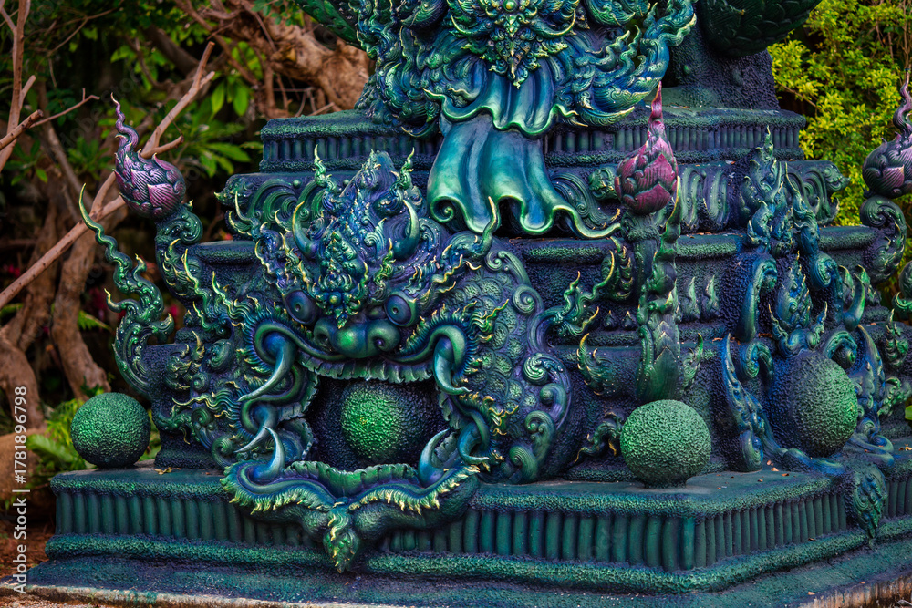 Obraz premium Background of Thailand's Chonburi religious attractions (Wat Khao Phra Khru viewpoint), with beautiful Buddha and Phaya Naga statues, tourists always come to make merit and take pictures at night.