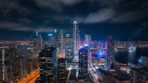 Wallpaper Mural Stunning time-lapse aerial view of a massive city skyline transitioning from dusk to night, with street lights turning on and glowing. Torontodigital.ca