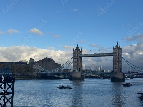 view of the tower bridge in london at a sunny autumn afternoon