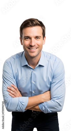 A smiling man in a blue shirt, with his arms crossed, against a white background.
