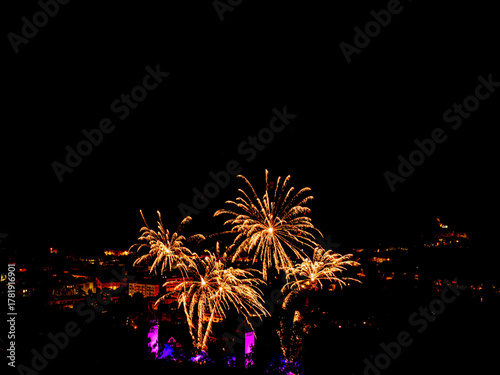 Spectacular fireworks over a historic city for festive events