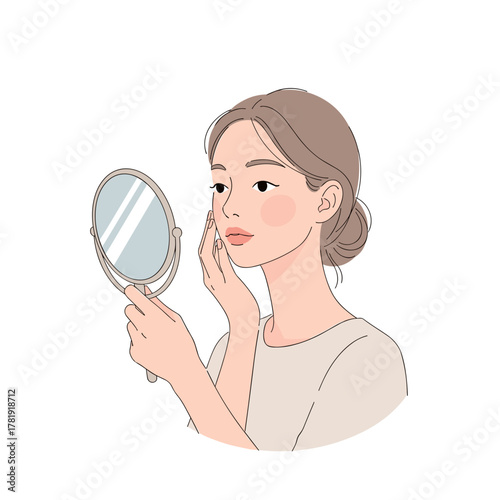 Young woman examining skin in handheld mirror, white background