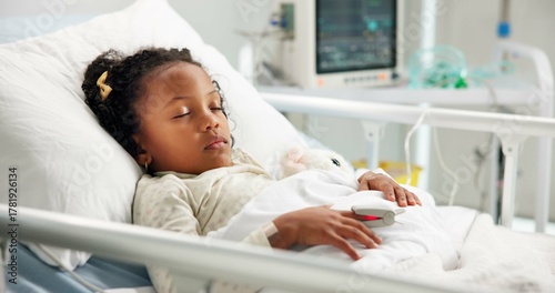 Medical, sleeping and patient or child in hospital bed for icu recovery, immune system rehabilitation and sickness. Healthcare, pediatrician treatment and rest with kid in clinic for monitor progress