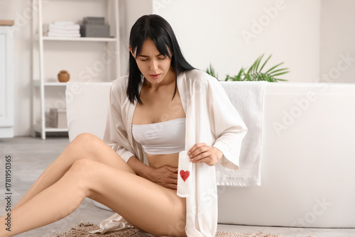 Young woman with pad suffer...