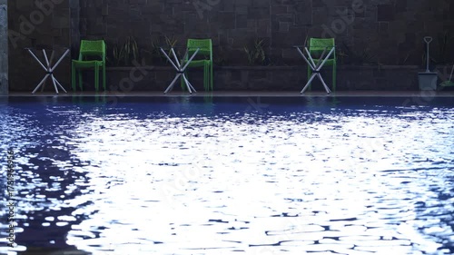Footage of a swimming pool, chairs in a hotel shot at afternoon. Blue reflecting pool urban city architecture scenic environment
