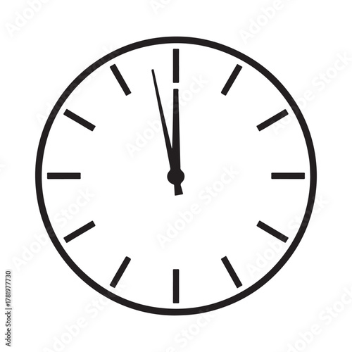 Simple analog clock face showing almost midnight or noon