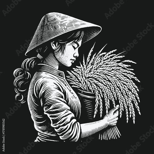 Asian woman in traditional conical hat holding harvested rice.