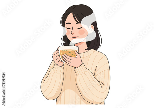 A serene young woman in a cozy sweater enjoying the aroma of a hot beverage in a glass mug.