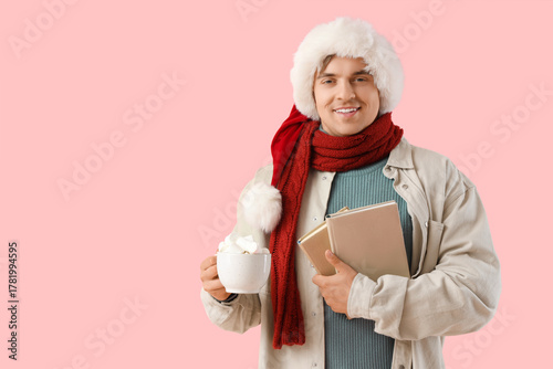 Young man in Santa hat and ...
