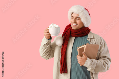 Young man in Santa hat and ...