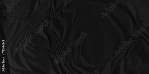 Black crumpled paper creased grunge texture. Paper wrinkled surface glued paper poster background. Crumpled and top view textures can be used for background of text or any contents.	