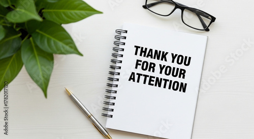 Thank You For Your Attention text on a spiral notebook.